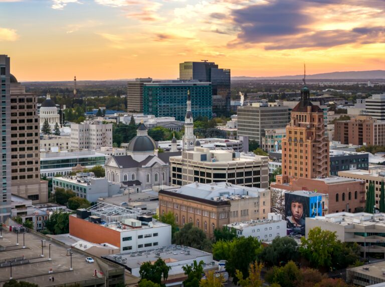 Aerial view of downtown Modesto, California at sunset, representing the nearest Live Scan near Modesto fingerprinting locations for local applicants.
